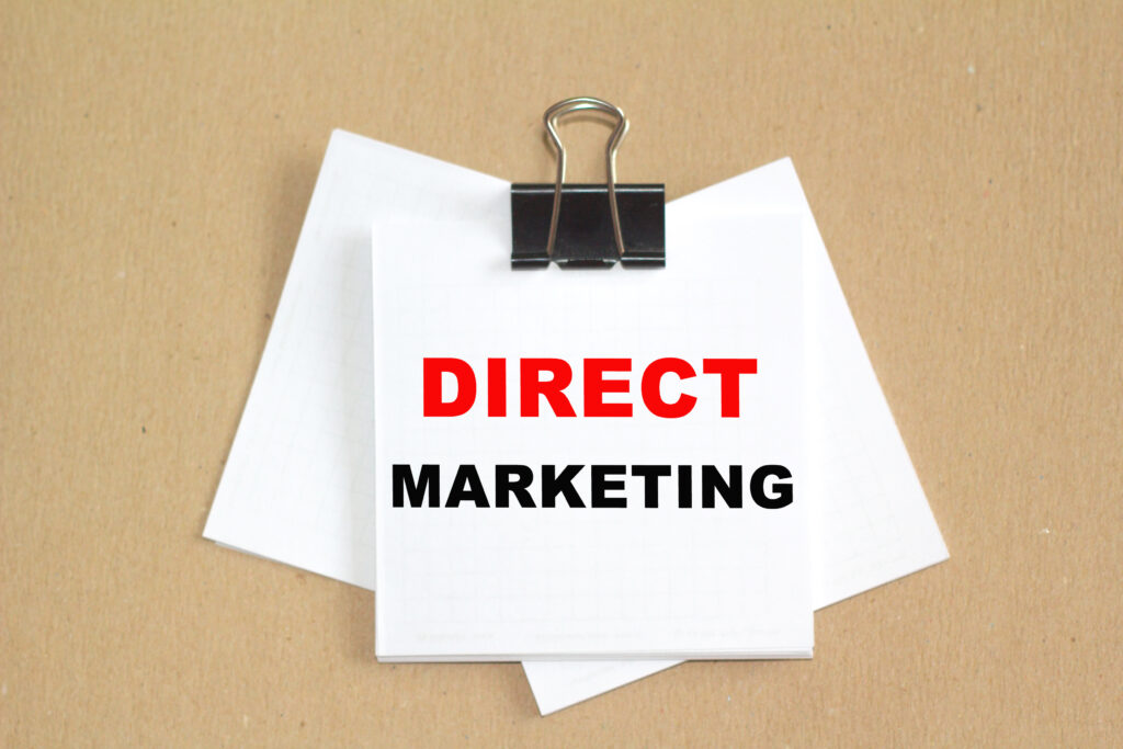 Direct marketing text written on a paper.