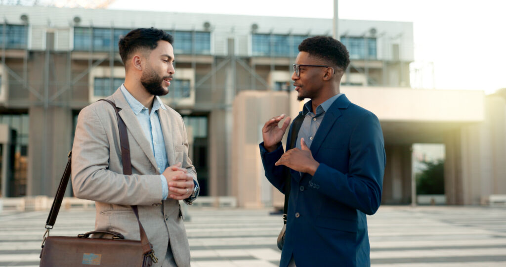 A sales representative talking to a customer during a face-to-face marketing meeting.